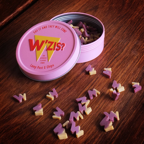 Dog treats in a pink tin