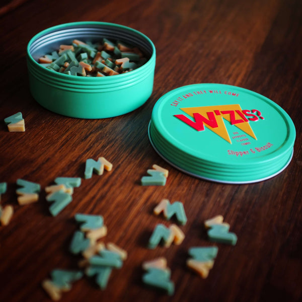 Dog treats in a green tin